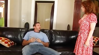 Cruel guy is posing on sofa before hot bitch